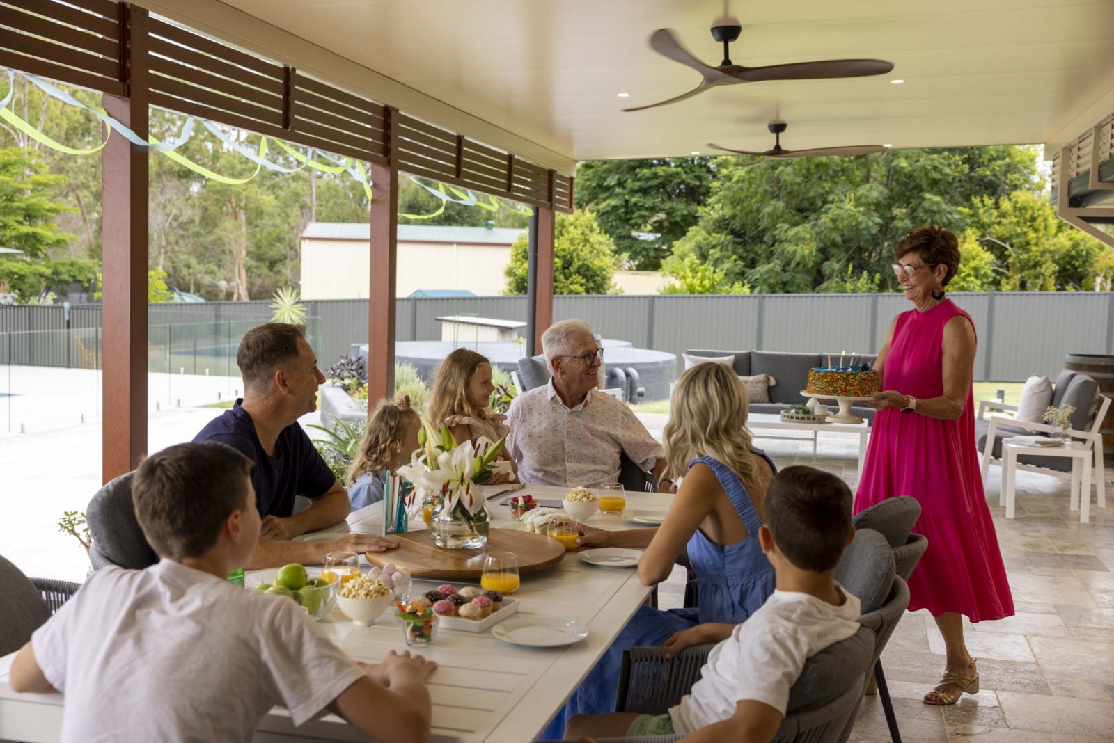 Family celebrating birthday on Apollo Patio